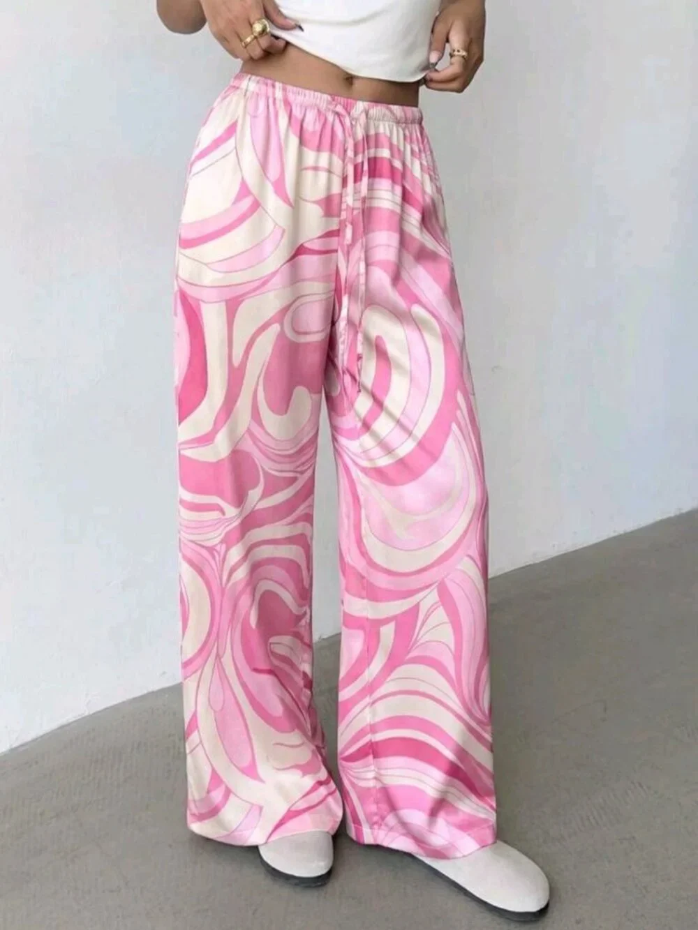 Women's loose-fitting satin pants with a low rise